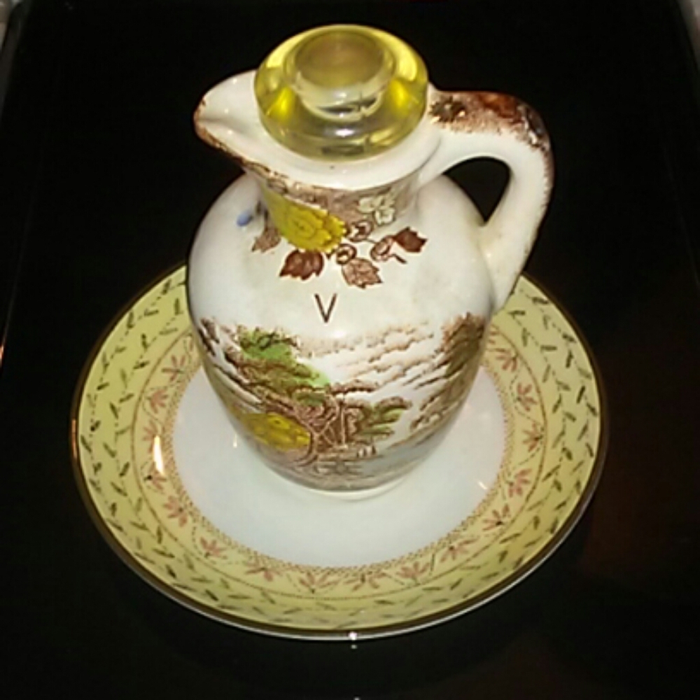 Small porcelain plate with China pitcher
